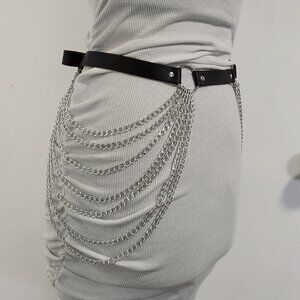 Faux leather belt with decorative hanging chains. Fits waist/hips size 29"-38"